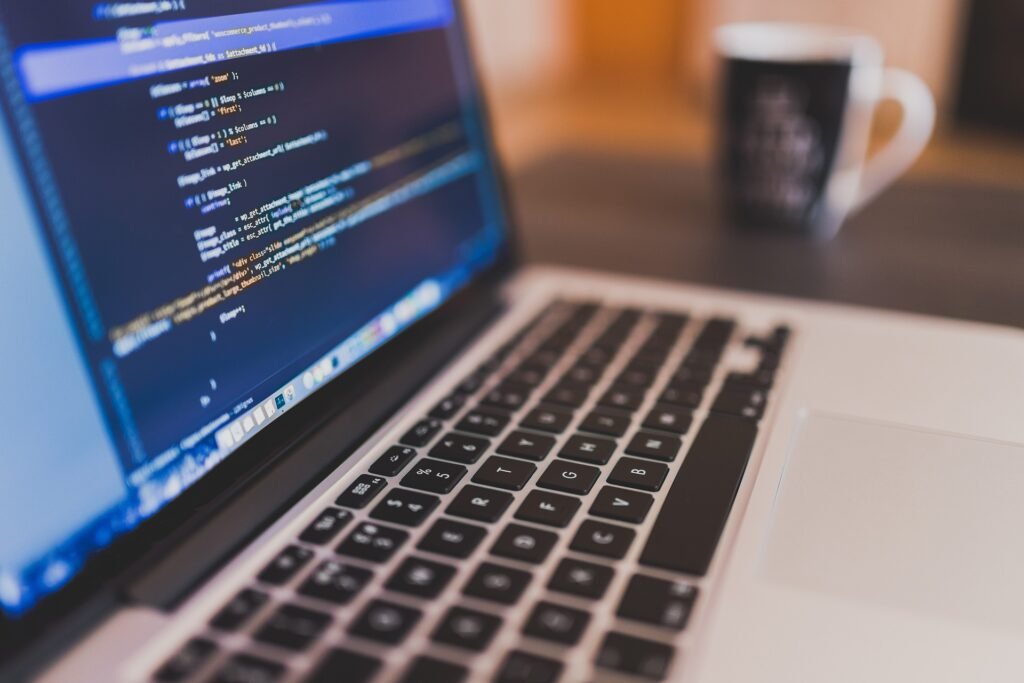 laptop with code in the screen